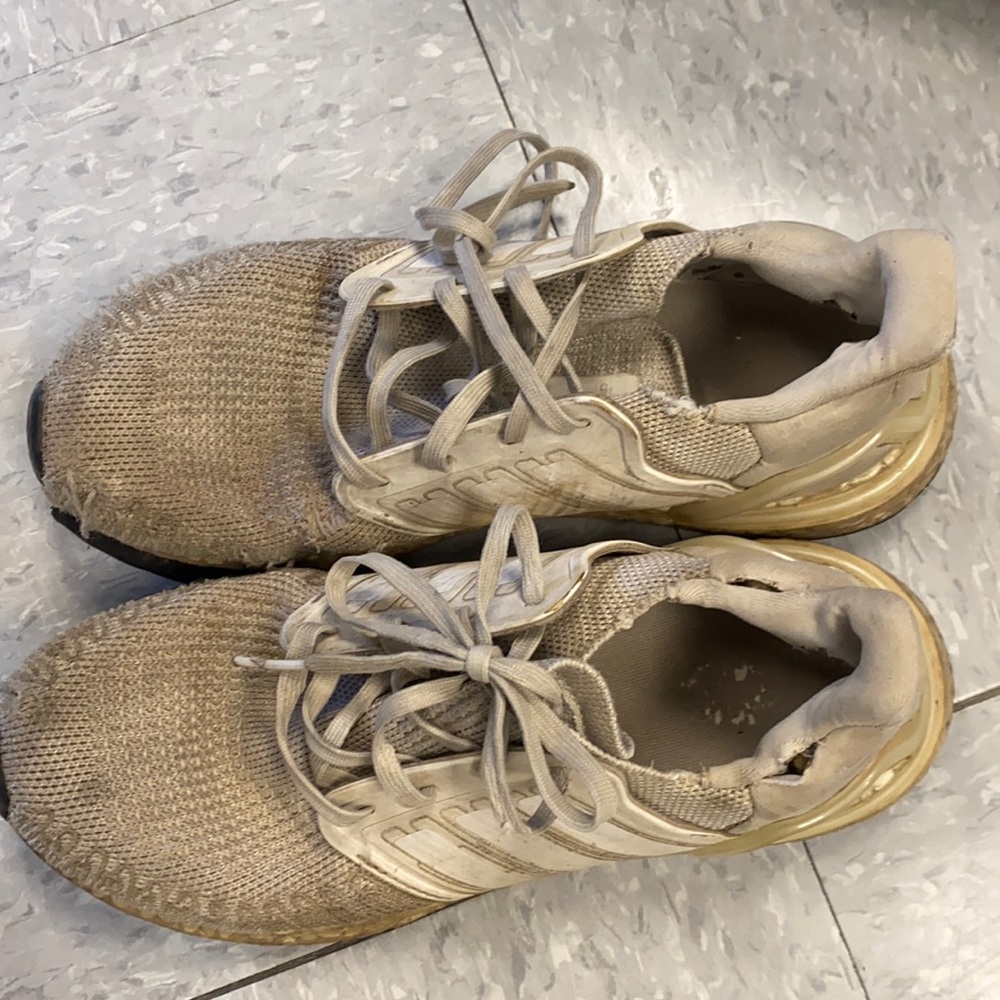 Very rundown adidas sneakers